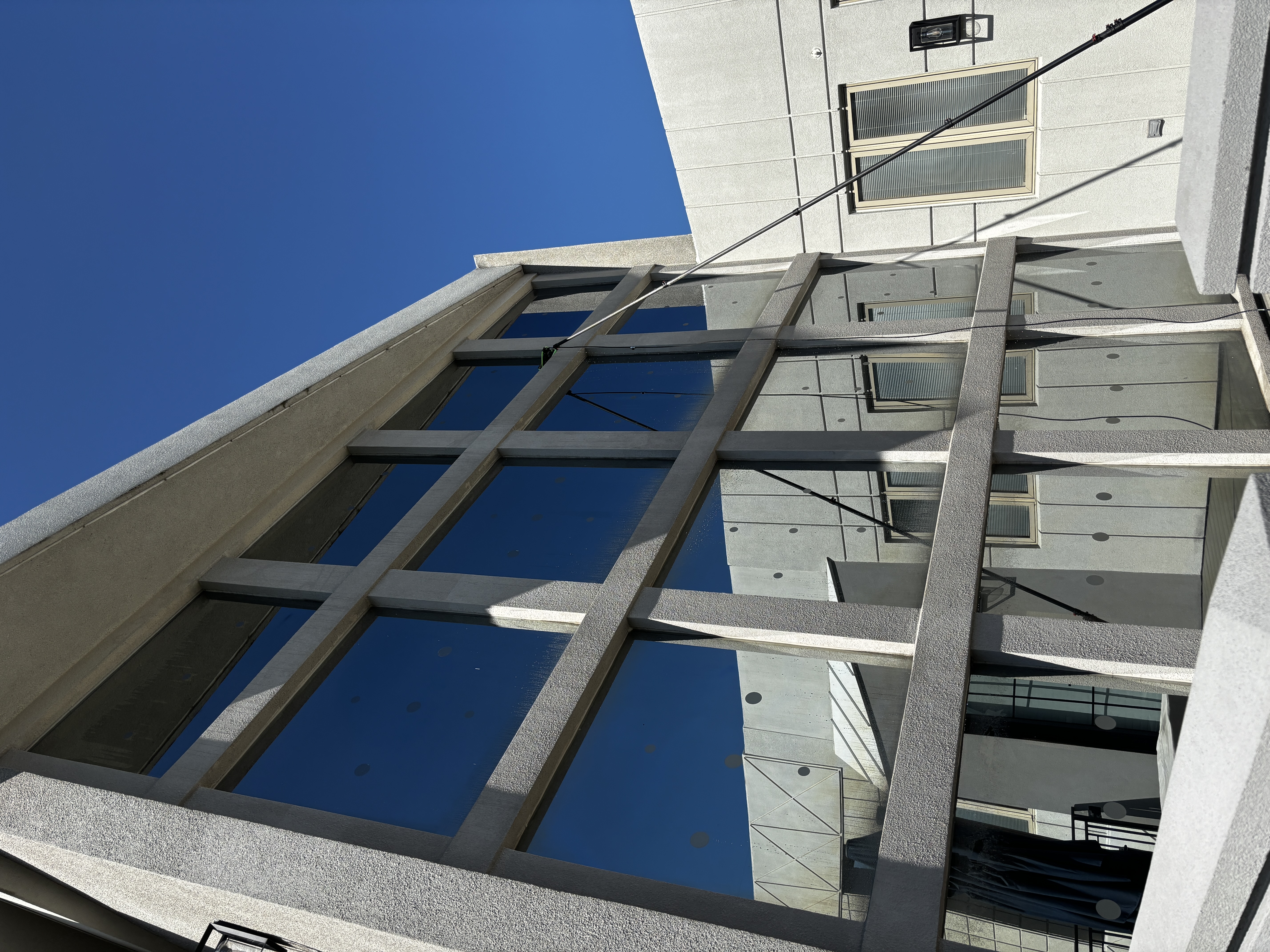 Large commercial building windows cleaned by ClearSide Exteriors