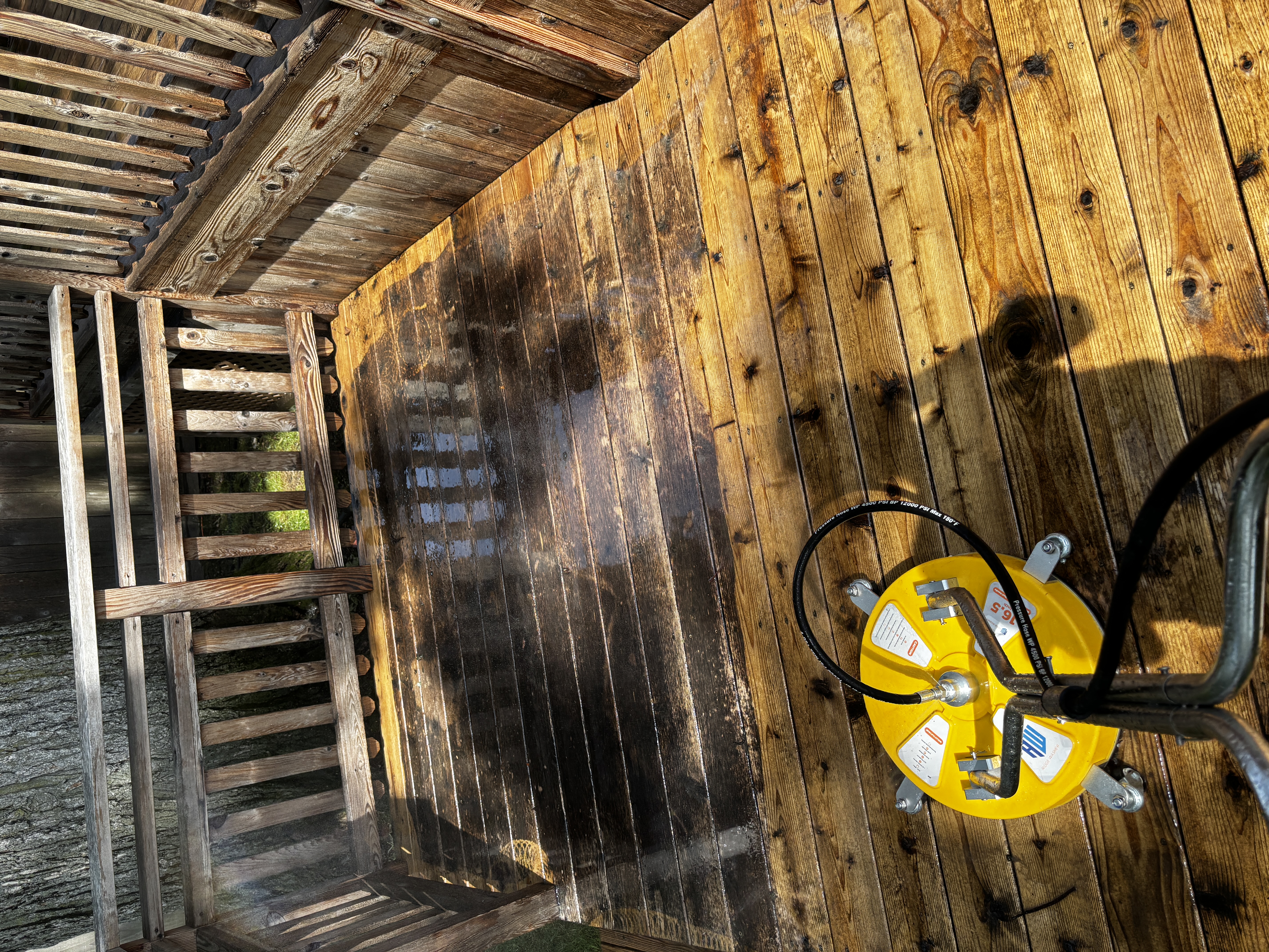 Deck pressure washing with surface cleaner attachment